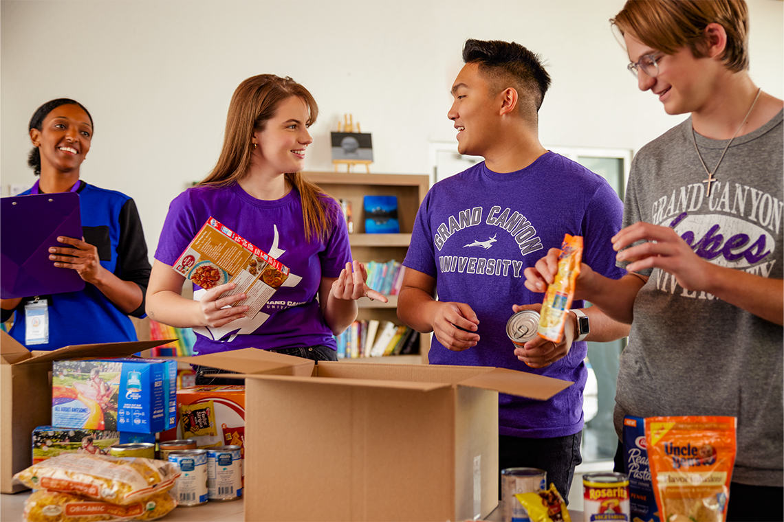 Three students and an instructor examining the nutrition labels on food products