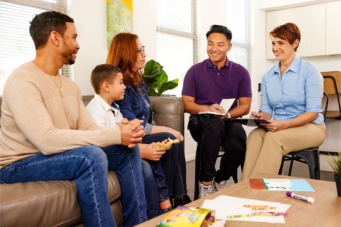 image of family gathered with counselor