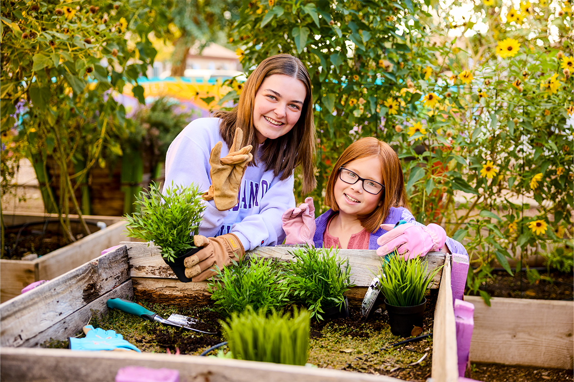image of a feamles tending to a garden
